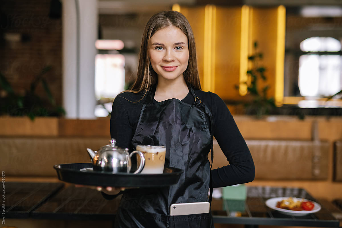 Polite waitress working in modish restaurant