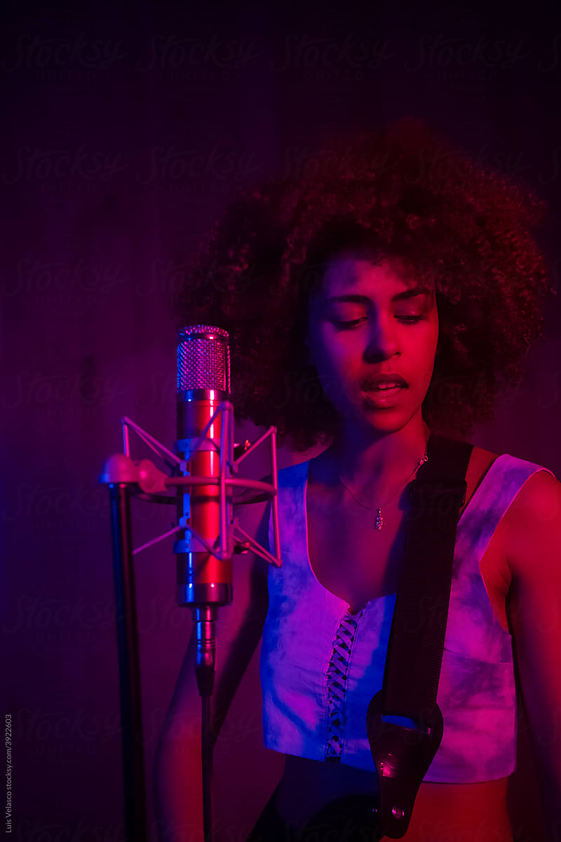 Black Woman Recording Music In The Studio.