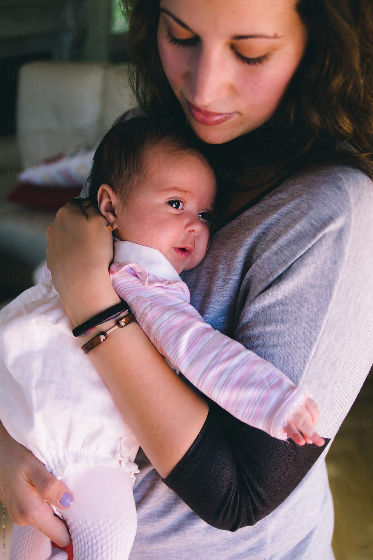 Babe Mother With Her Baby Babe On Her Arms By Stocksy Contributor Alejandro Moreno De