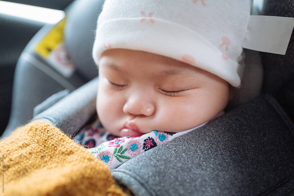 cute baby girl sleeping in Safety seats in car