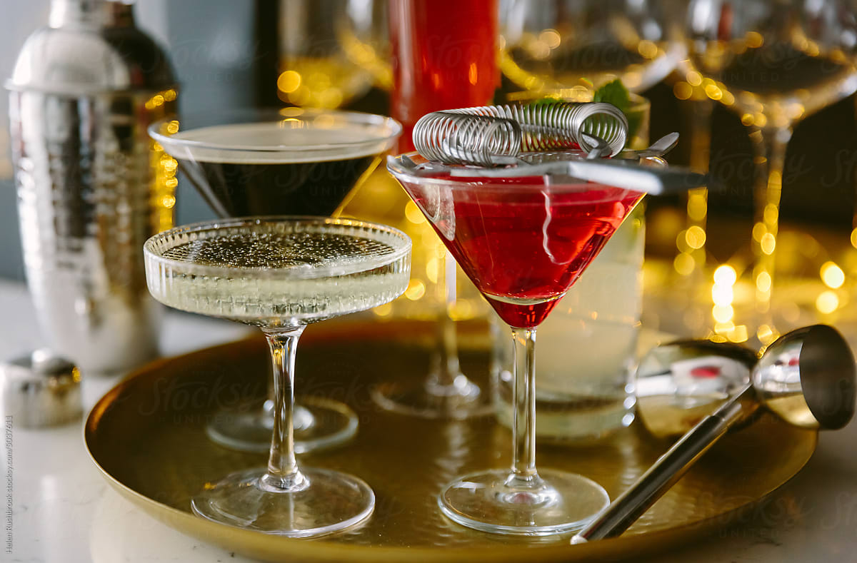 A selection of cocktails on a brass tray
