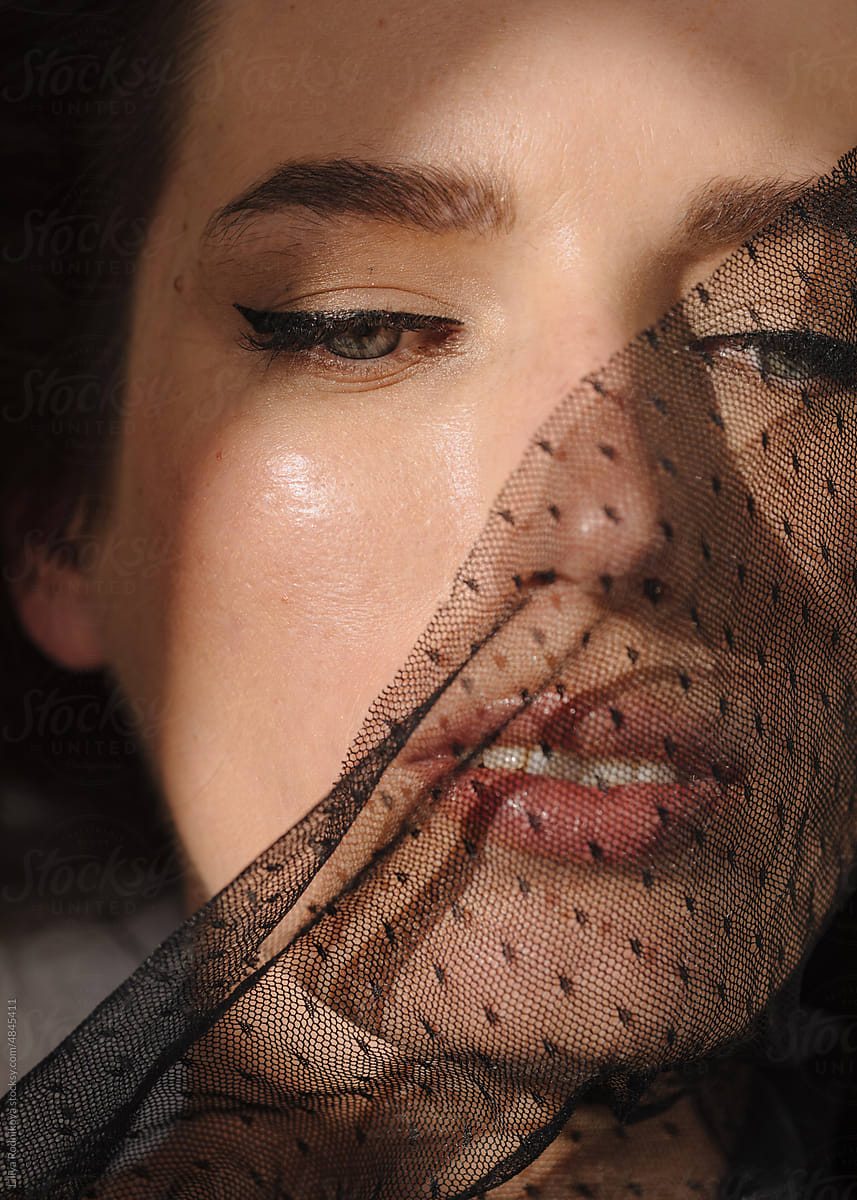 Closeup beauty portrait with black veil