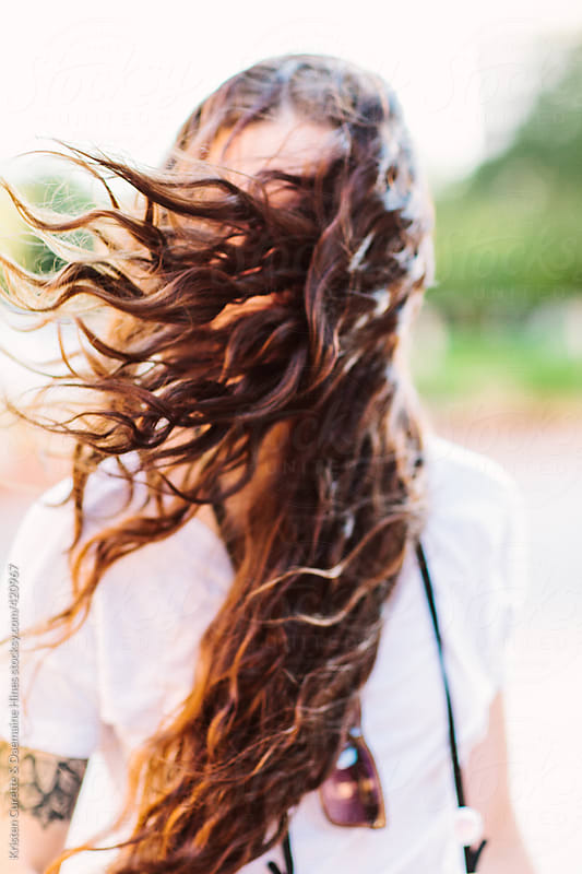 Hair blowing across the face by Kristen Curette Hines - Stocksy United