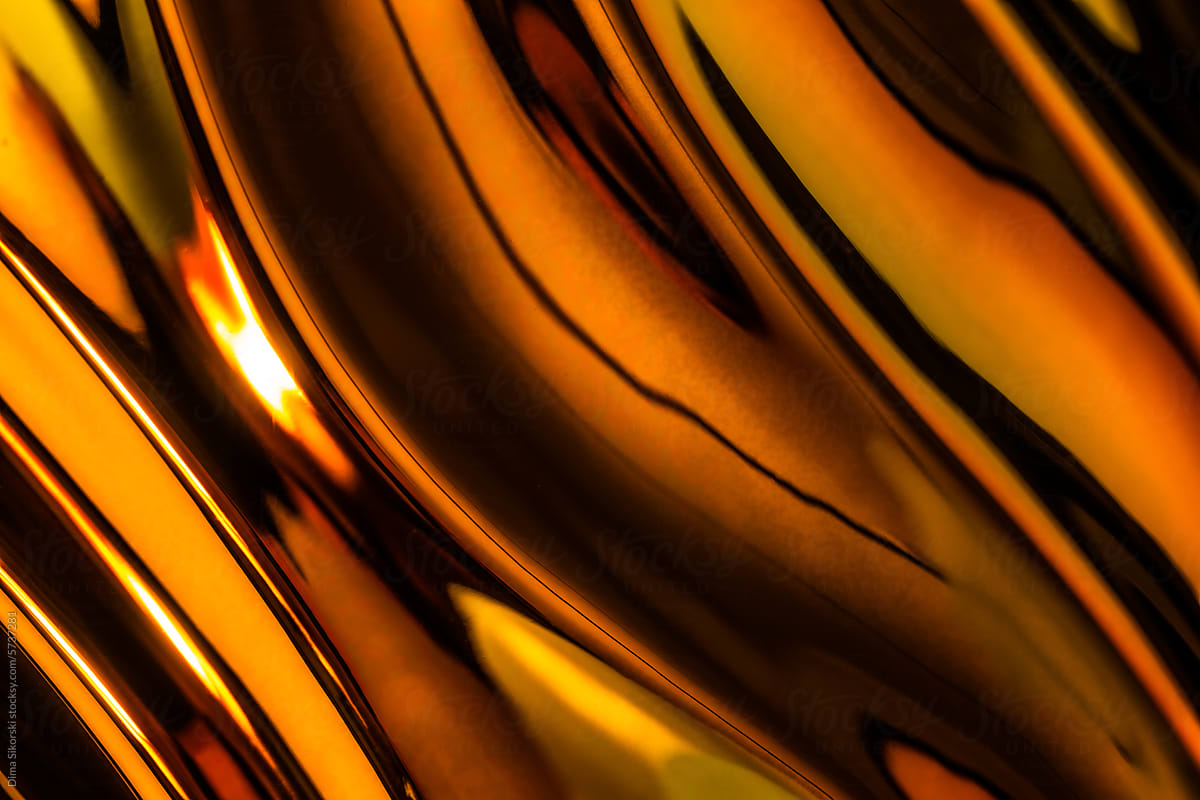 Abstraction of golden waves of metallic texture