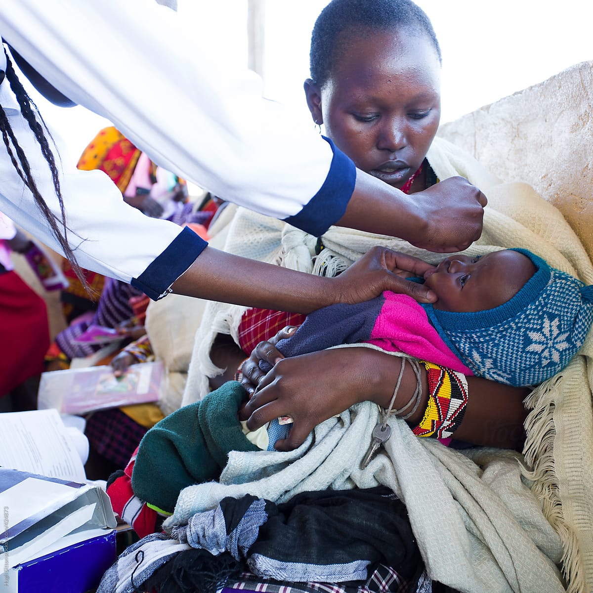 Baby receiving polio vaccine. Medical Clinic. Kenya. Africa.