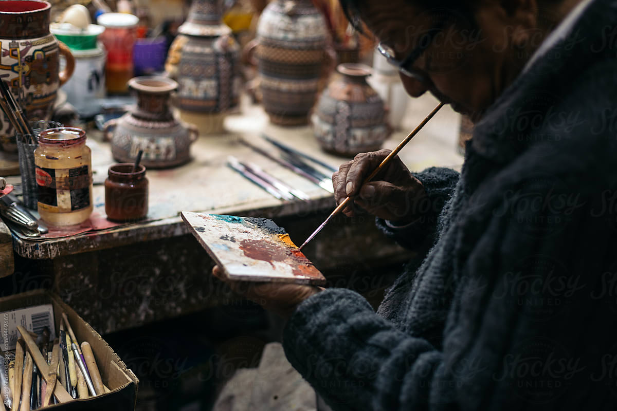 Ceramic artist working in his workshop