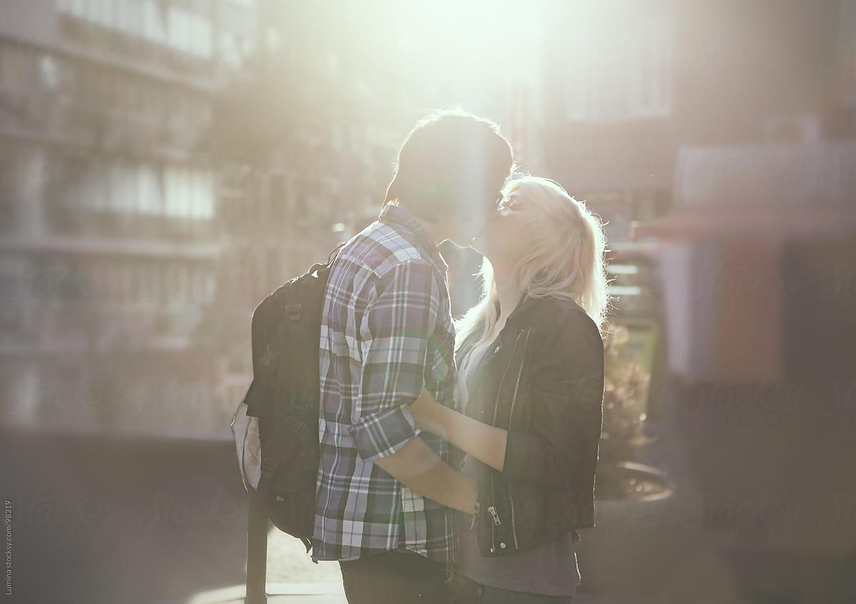 Teenage Couple Kissing On The Street By Stocksy Contributor Lumina Stocksy 