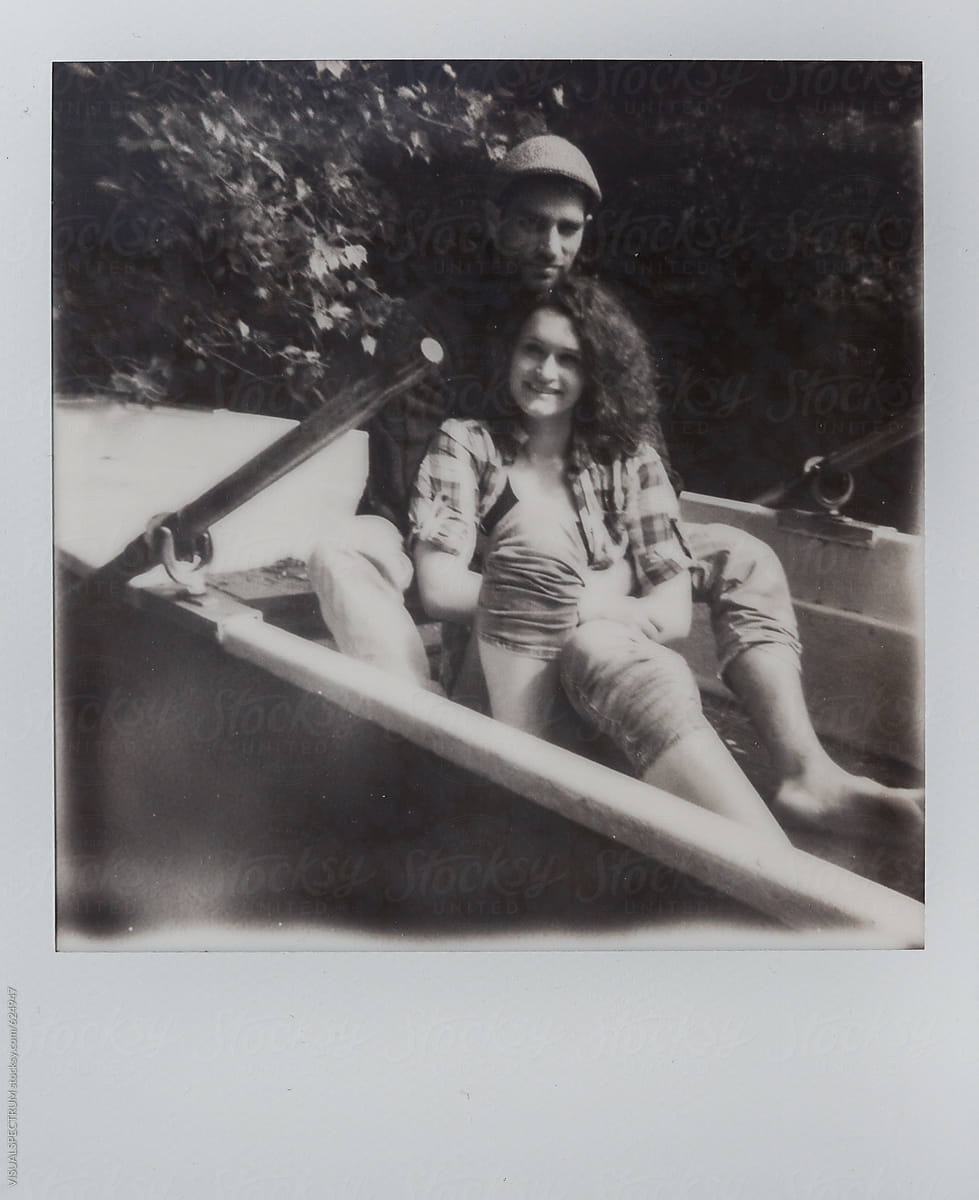 Black and White Polaroid Photo of Happy Young Couple in Rowing Boat