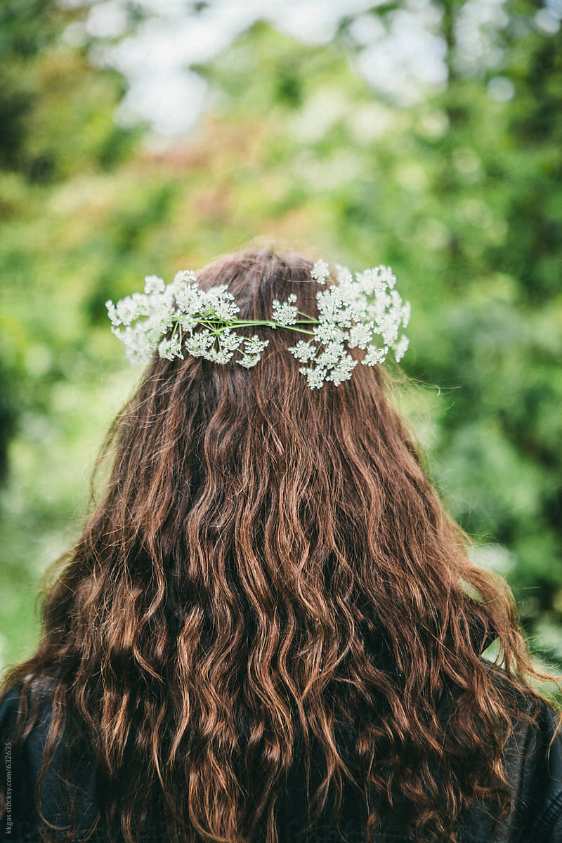 flower headband worn in beautiful long brown hair