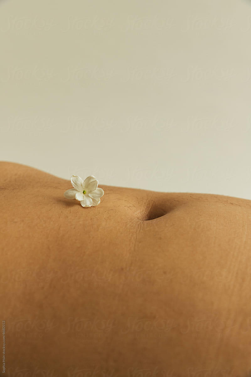 Single jasmine flower with belly button