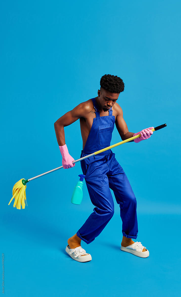Man dancing with mop