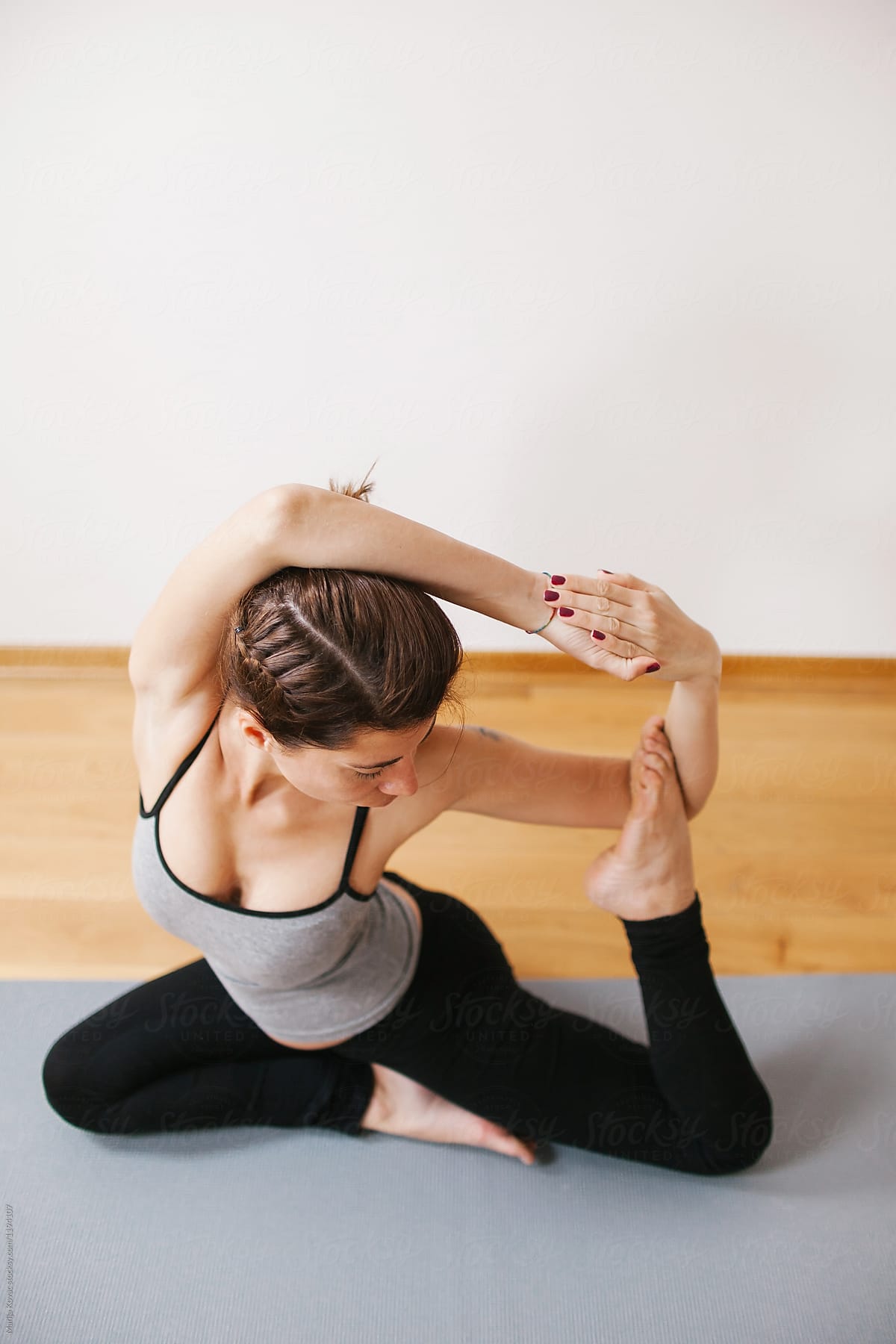 Two Women Doing Yoga Togethera by Stocksy Contributor Marija