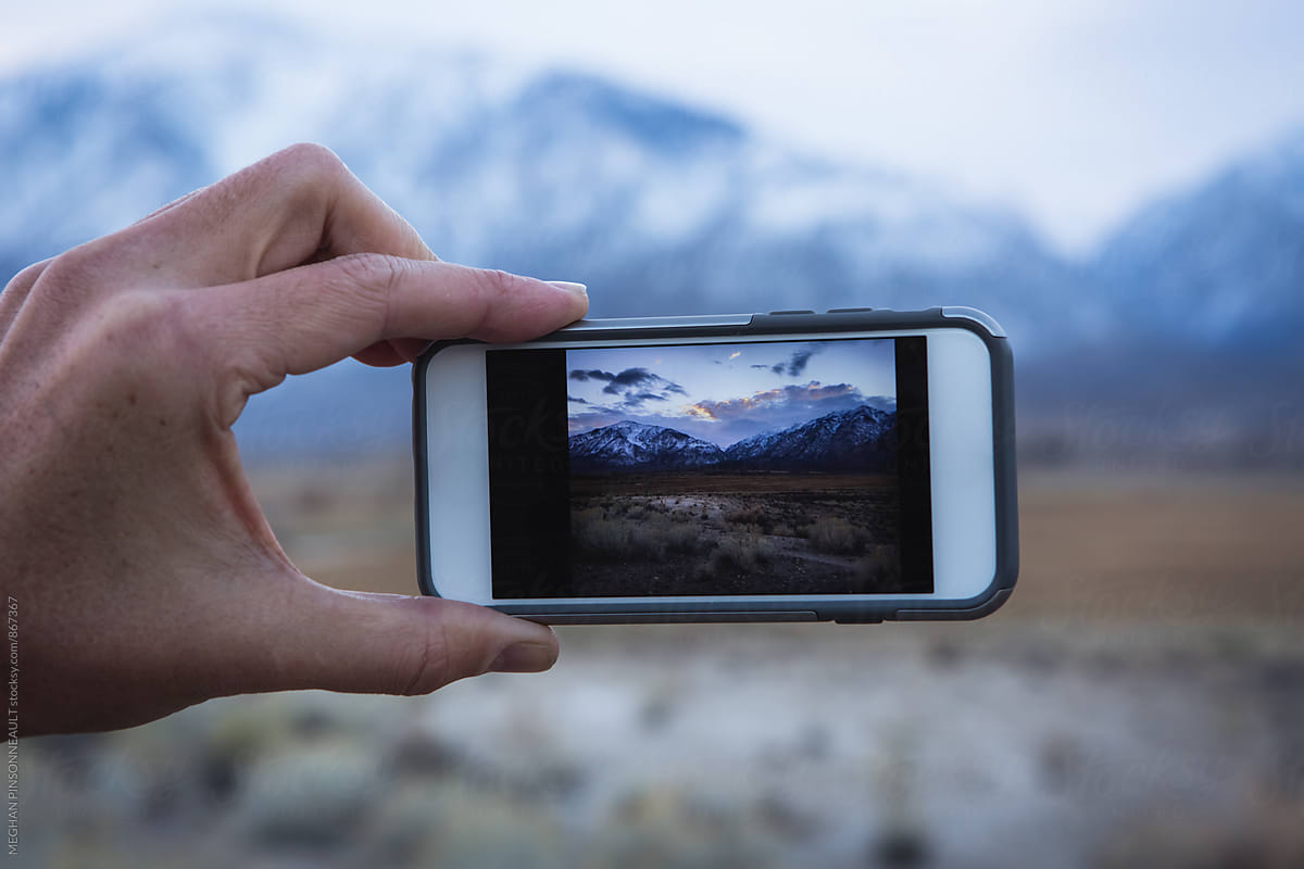 Smart Phone and Snow Mountains