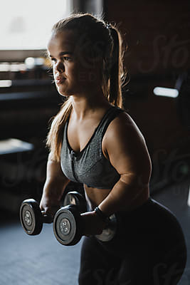 Portrait Of A Young Dwarf Woman In A Sport Bra, She Is Standing