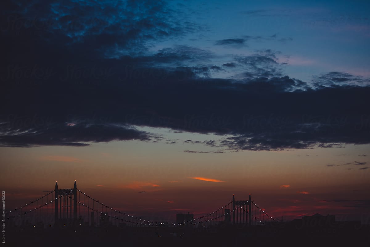 Lights on a bridge at sunset