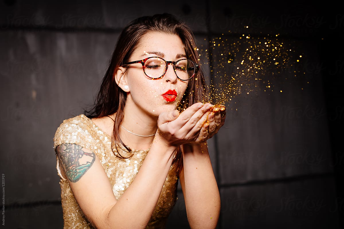 Girl Blowing Glitters Out Of Hands By Stocksy Contributor Andrey 