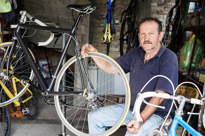 Bicycle Mechanic in his Workshop