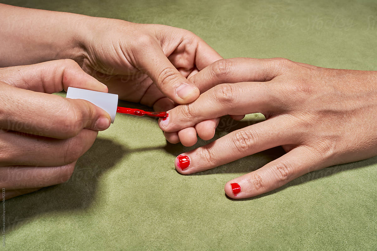 Painting the nails of a transgender person
