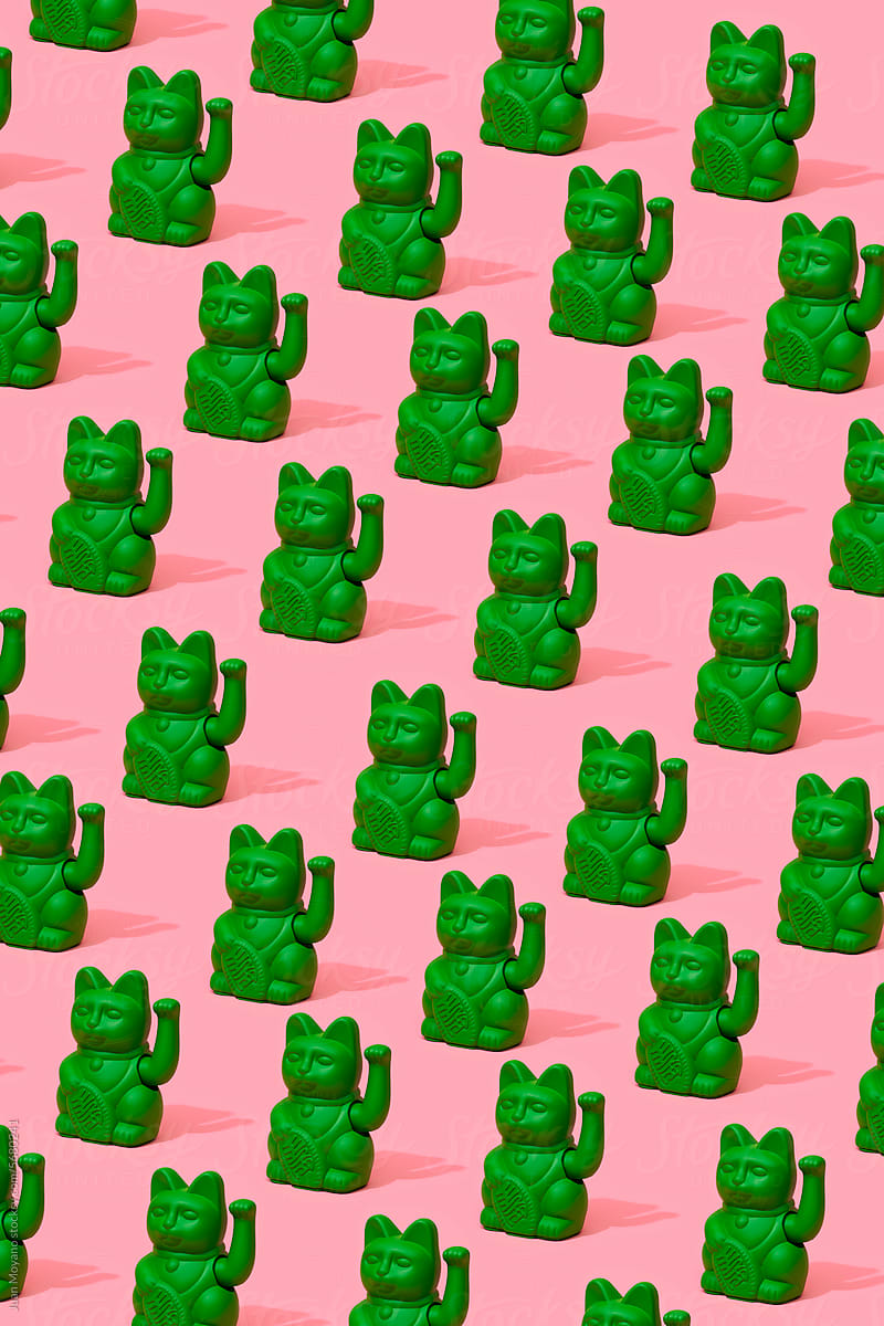 green lucky cats forming a pattern