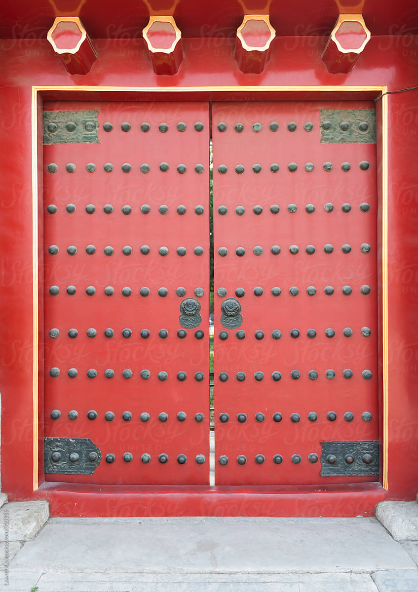 Traditional red door with lion head doorknob in China