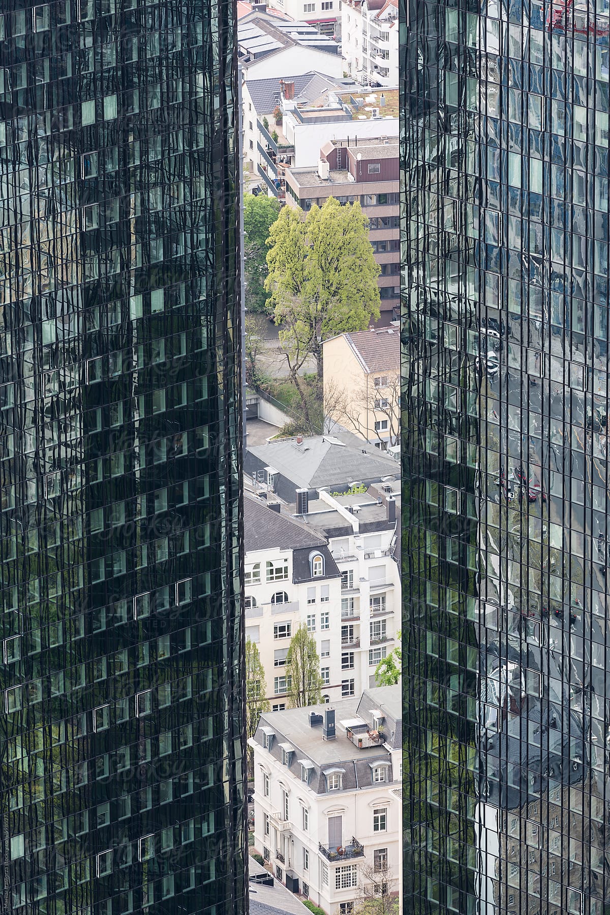 View of city buildings between two skyscrapers