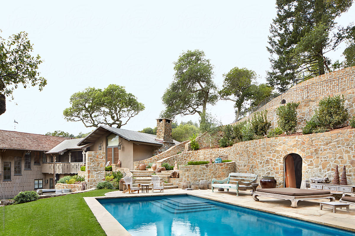Exterior of pool and landscaping of luxury home