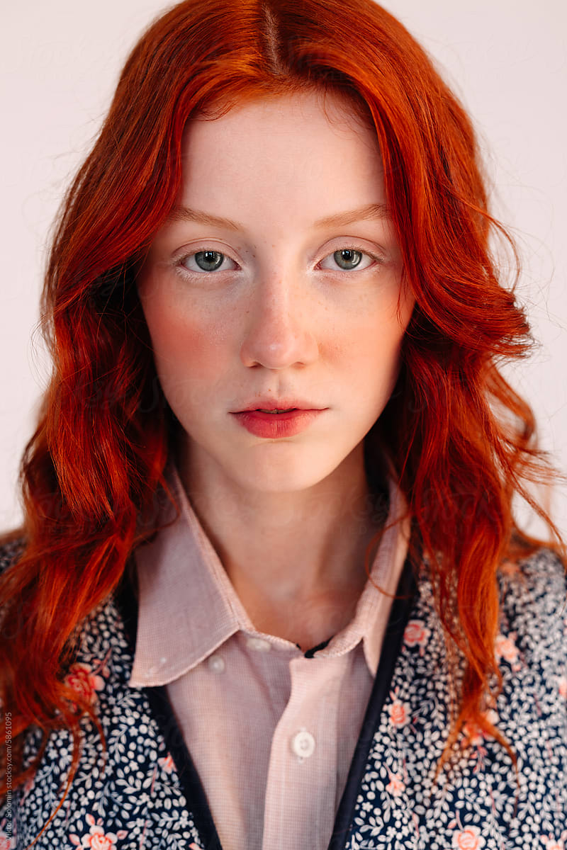 young ginger girl with long hair fashion portrait