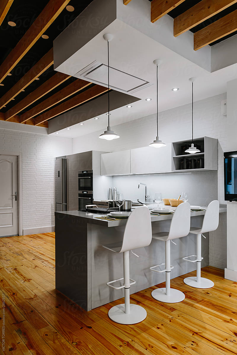 Cozy modern kitchen with wooden flooring