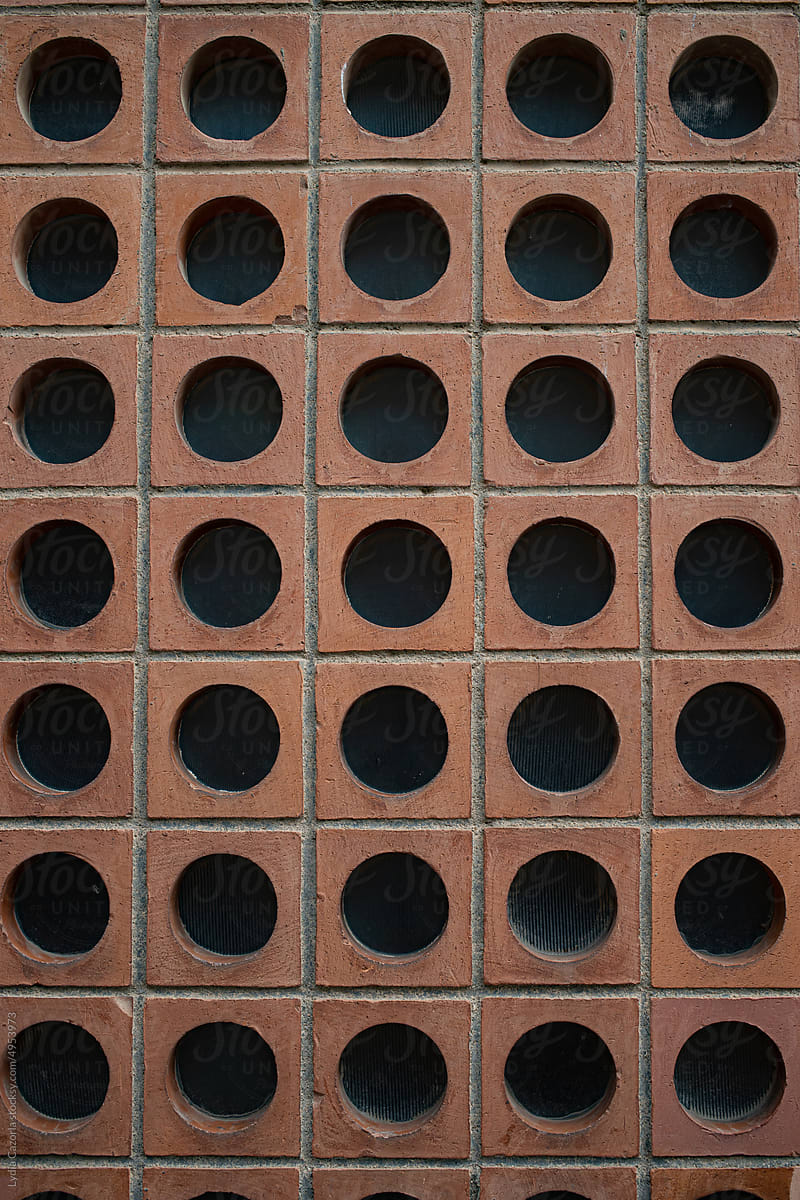 Facade With Black Concrete Holes