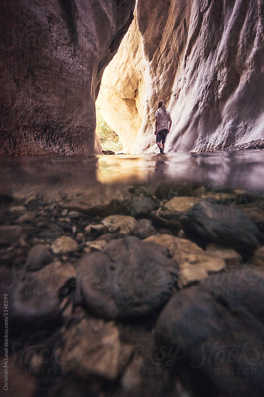man leaving a gorge in the desert