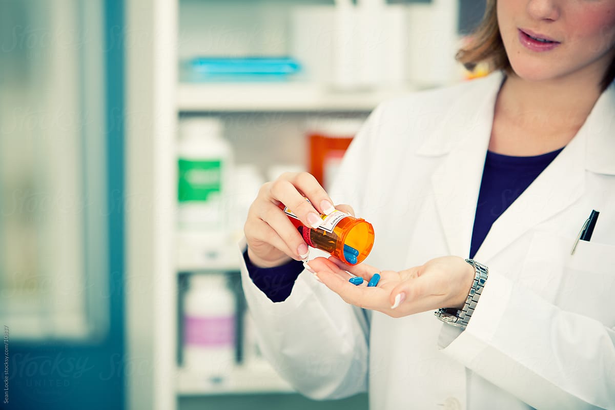 Pharmacy: Checking Medicine Inside Bottle
