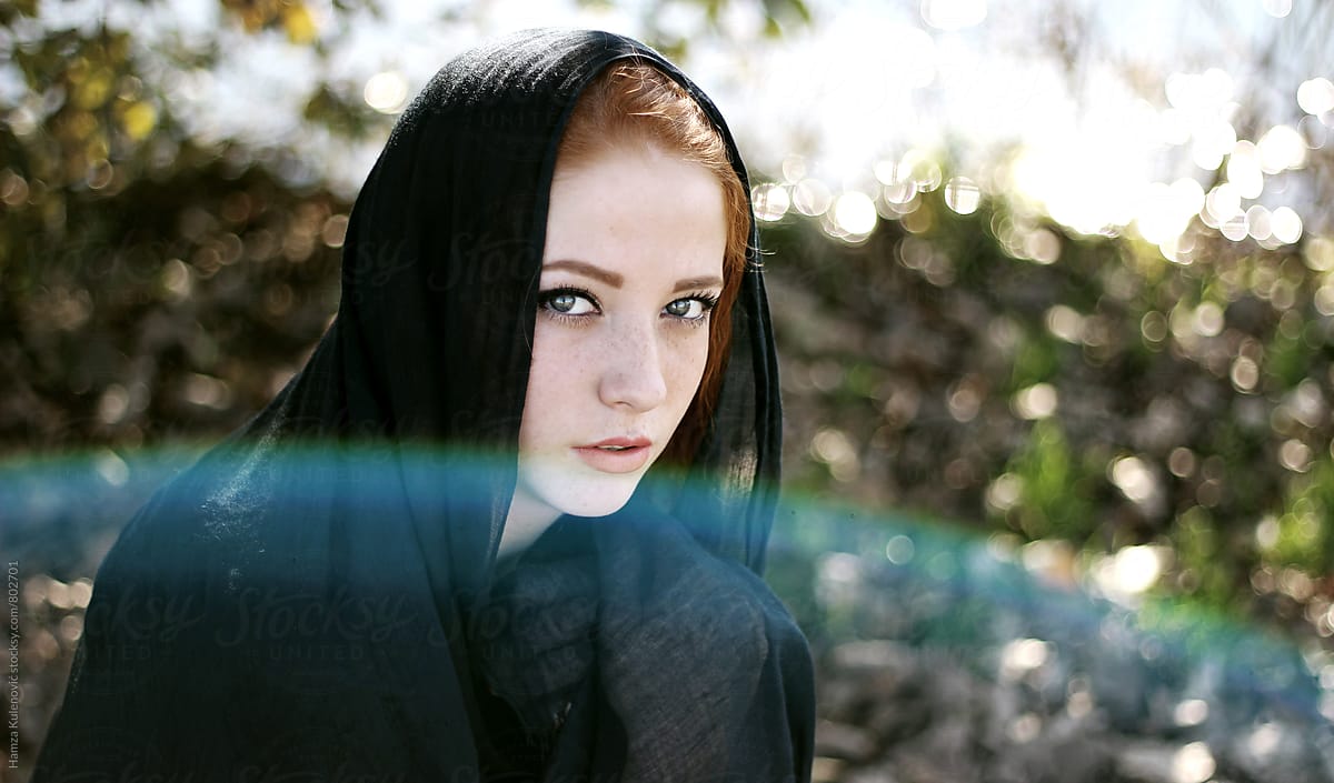 Young ginger woman with black scarf