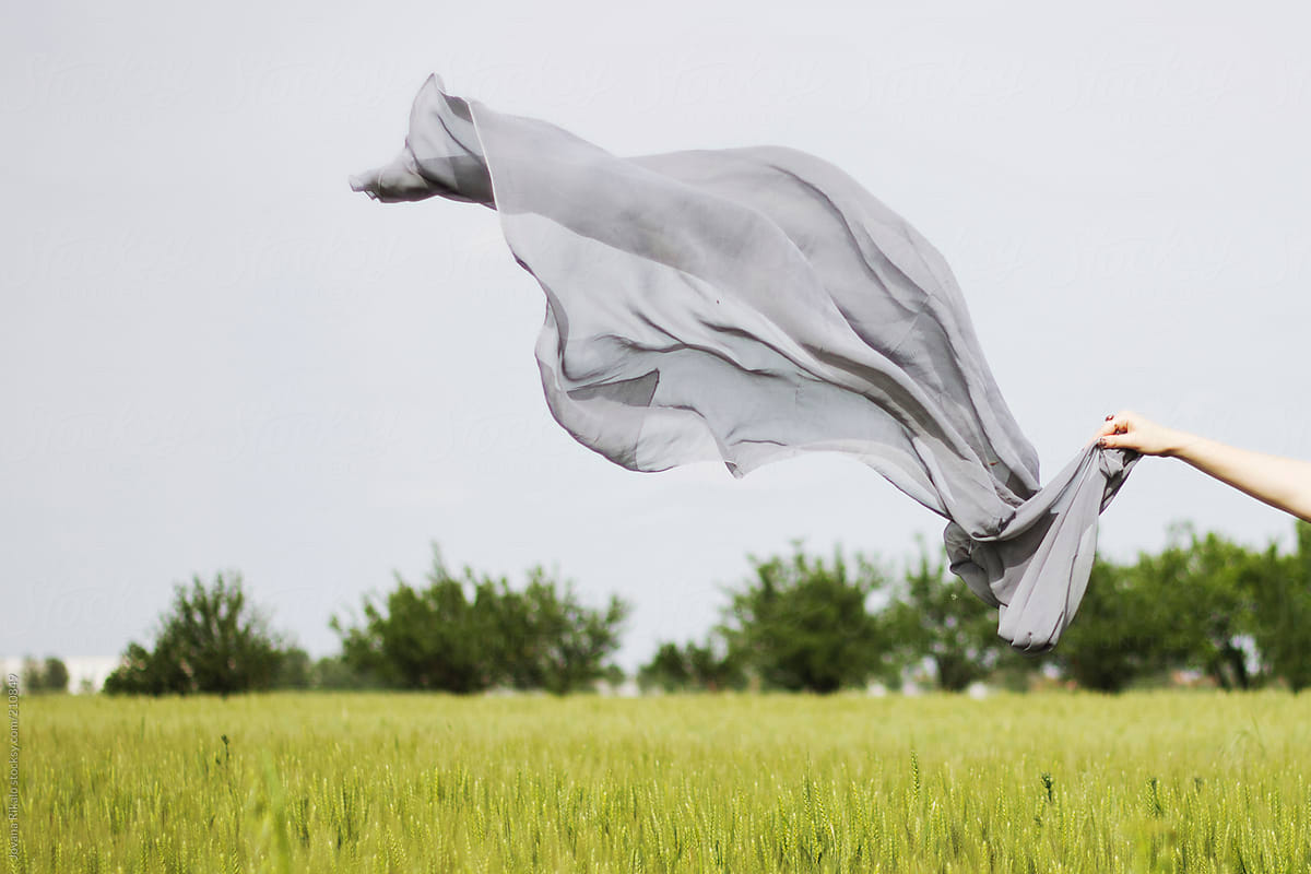 Grey scarf flying on the wind