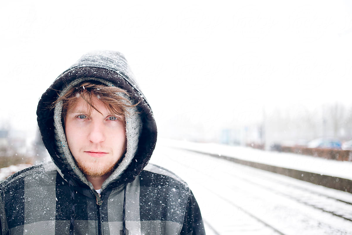 Young man standing in the cold