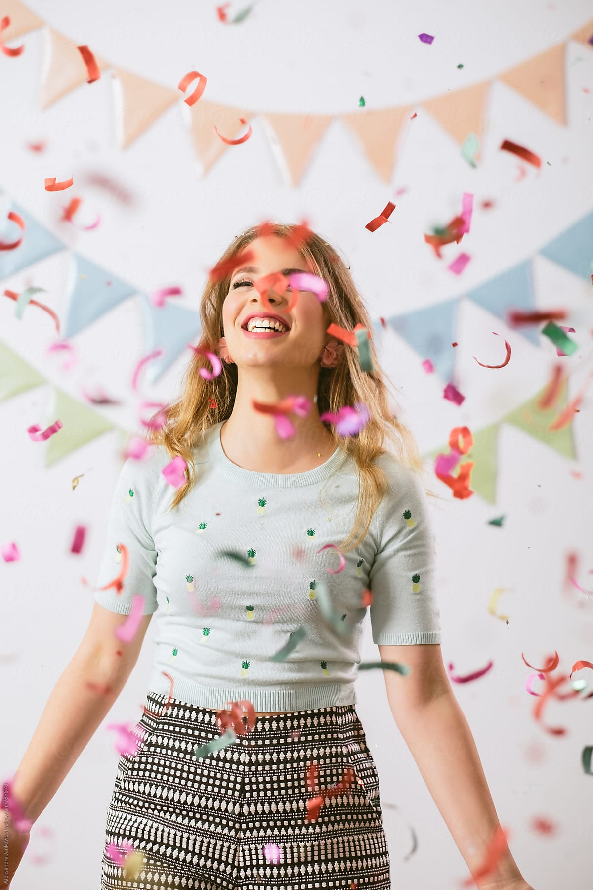 Smiling Caucasian Young Woman At The Party With Confetti