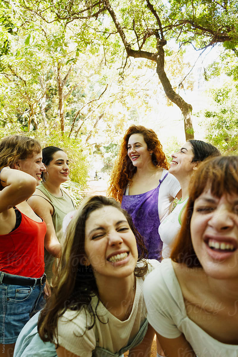 Diverse female friends laughing together during their holidays
