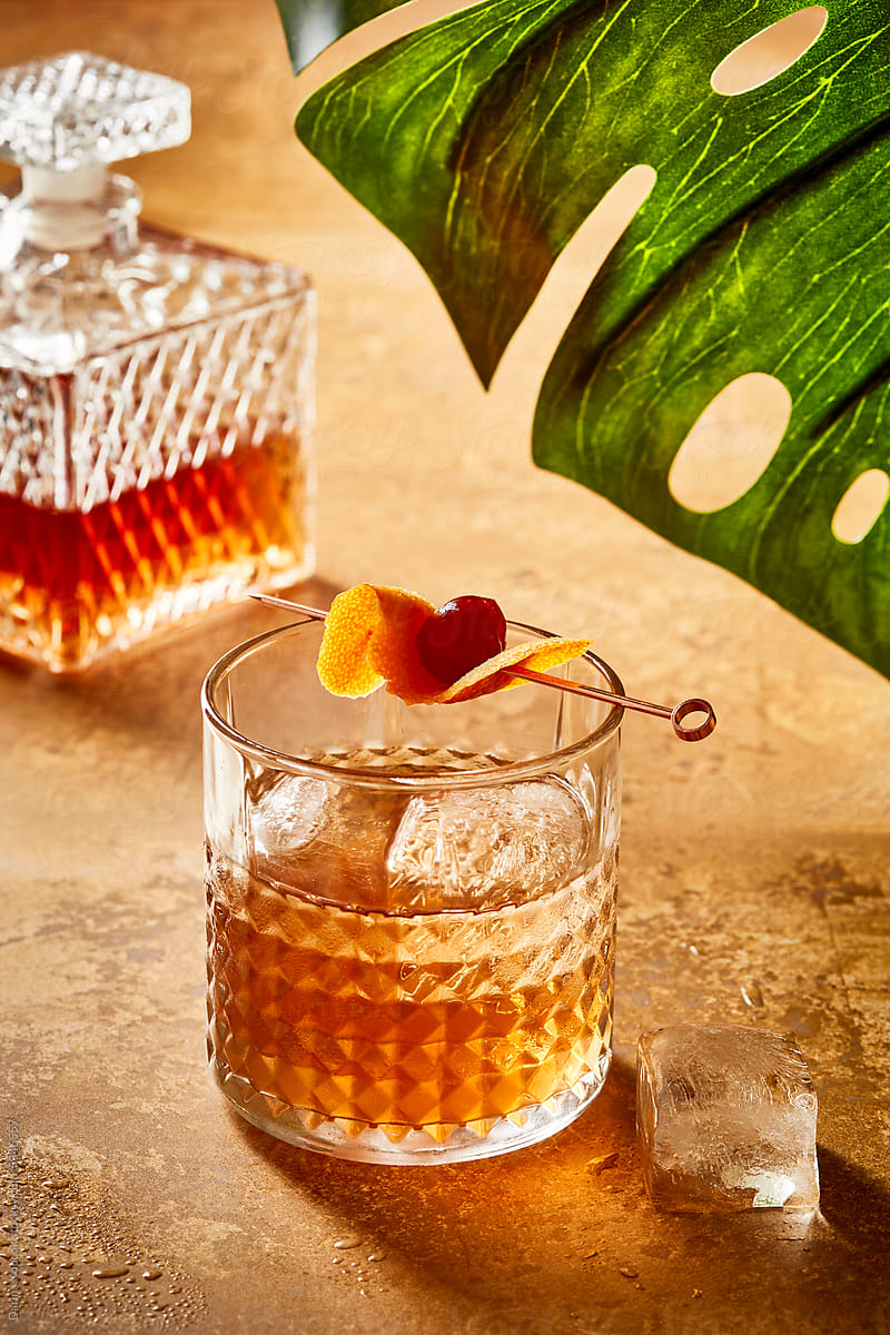 Old Fashioned with Decanter under a Monstera Leaf