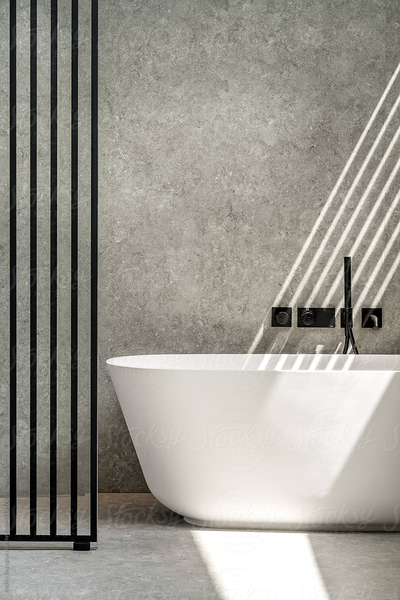 Interior of modern bathroom with tiled walls