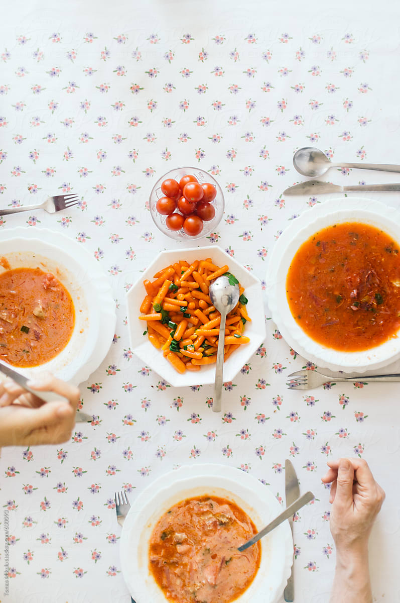 Family lunch with soup on the table