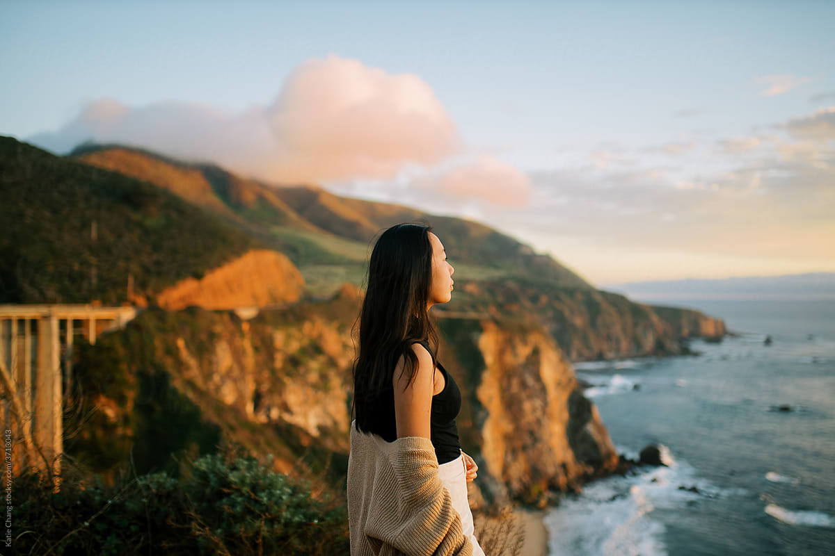 Girl Wearing Cardigan In Big Sur During Sunset