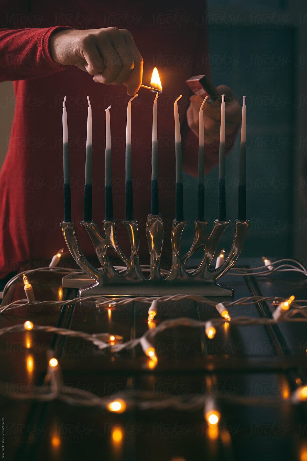 Hanukkah: Child Lighting Shamash Candle For Hanukkah