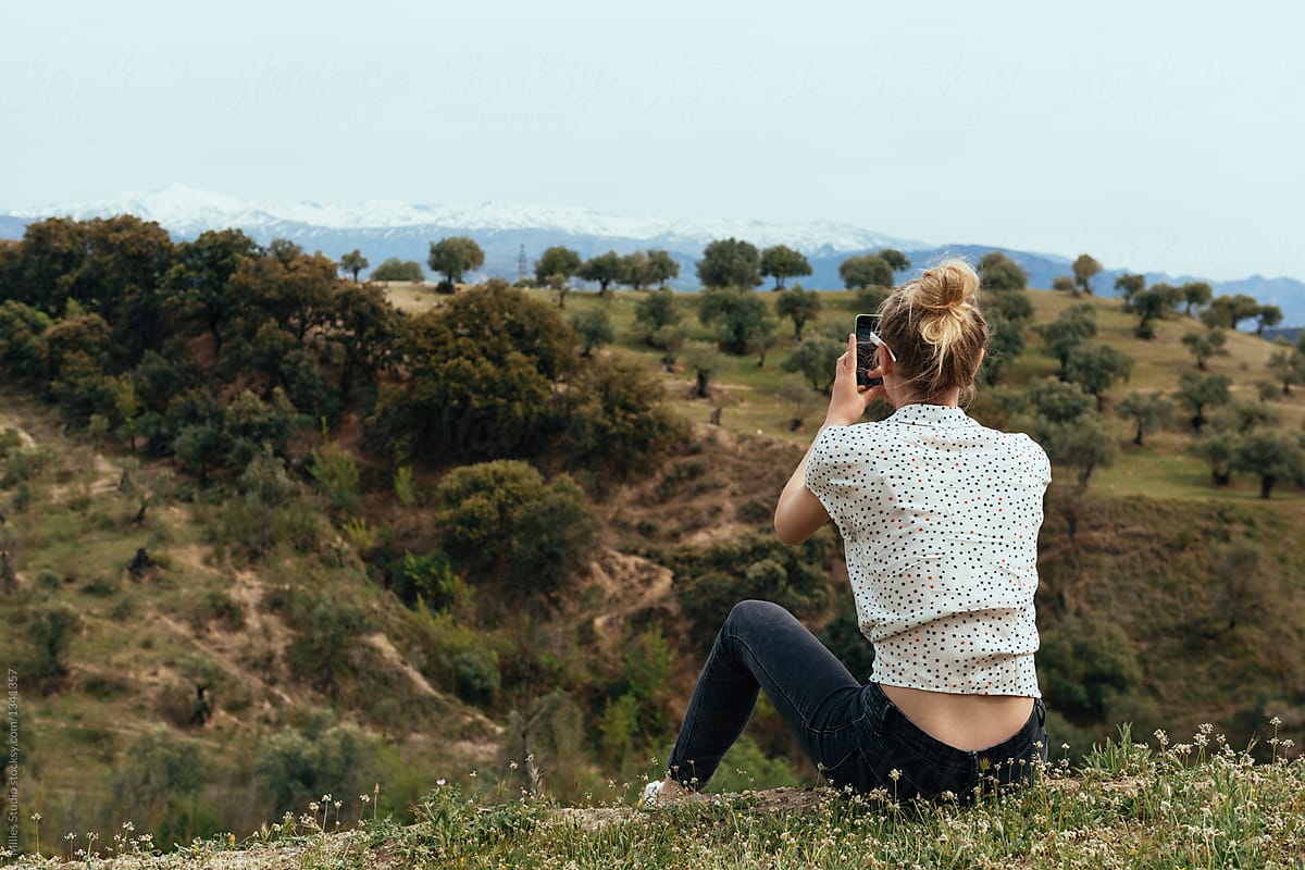Woman taking shots of landscape