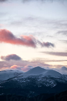 Sunset Over Mountains Covered With Snow