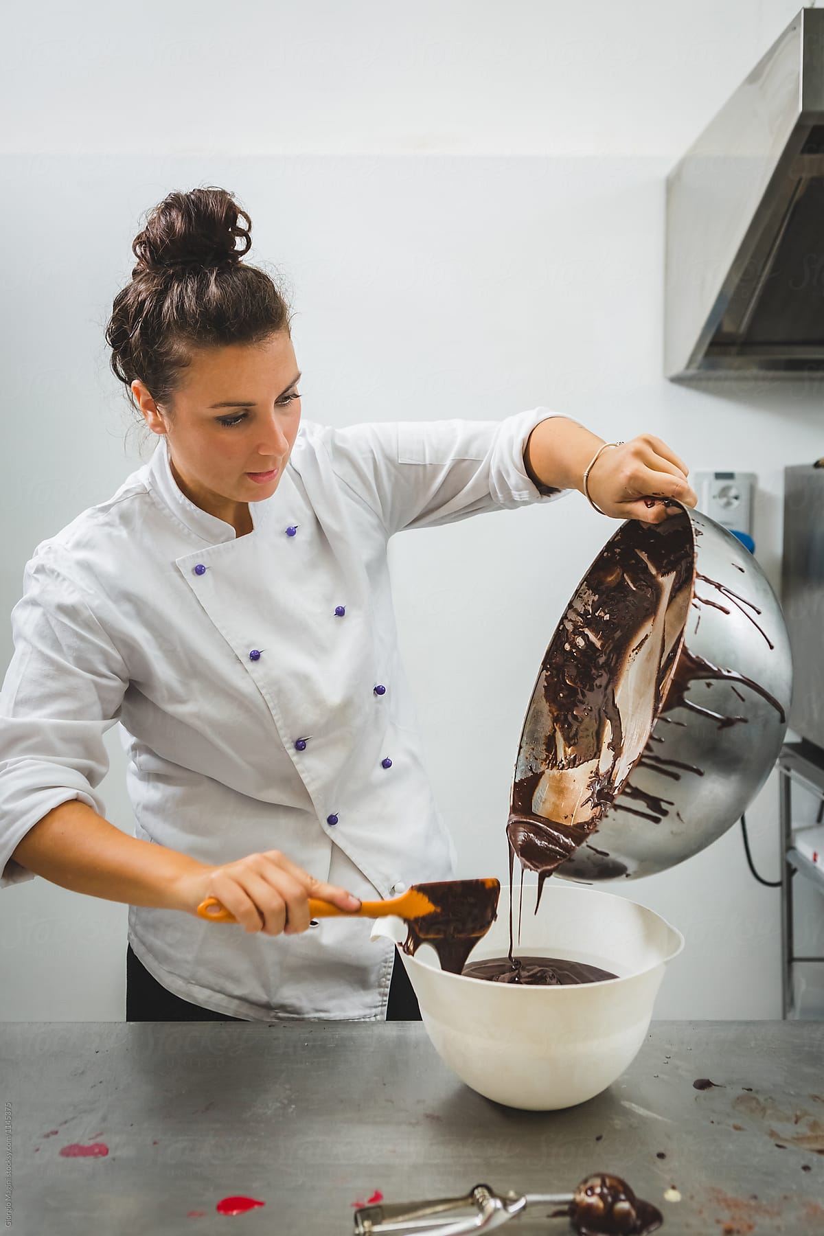 Pastry Chef Pouring Chocolate Batter in a Bowl