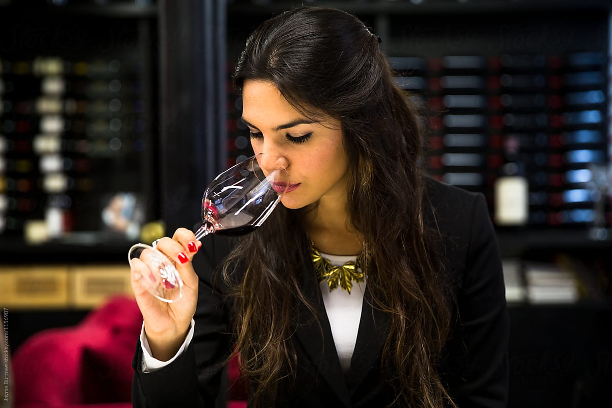 Professional Sommelier Examining Red Wine