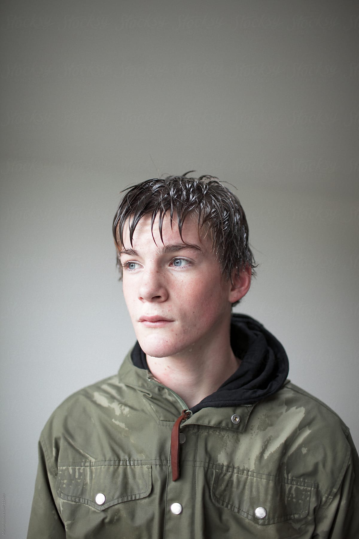 Portrait of a teenage boy wet from the rain