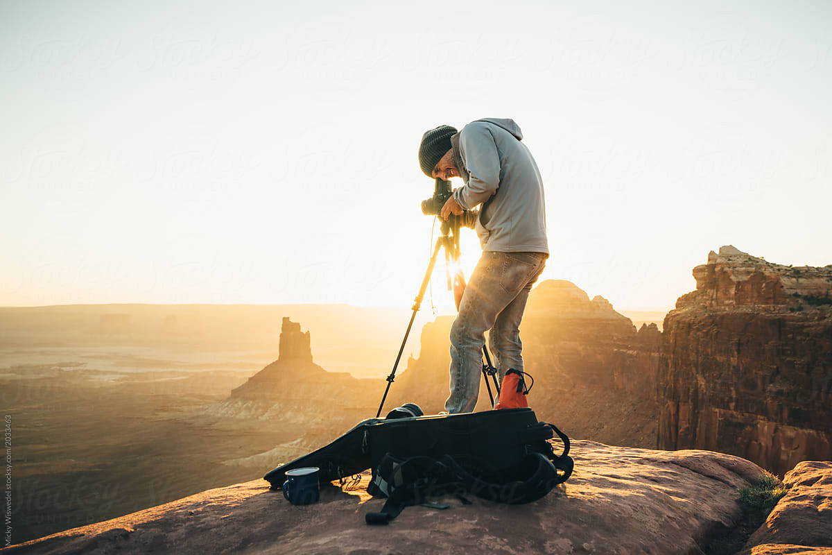 Photographer at sunset in the desert