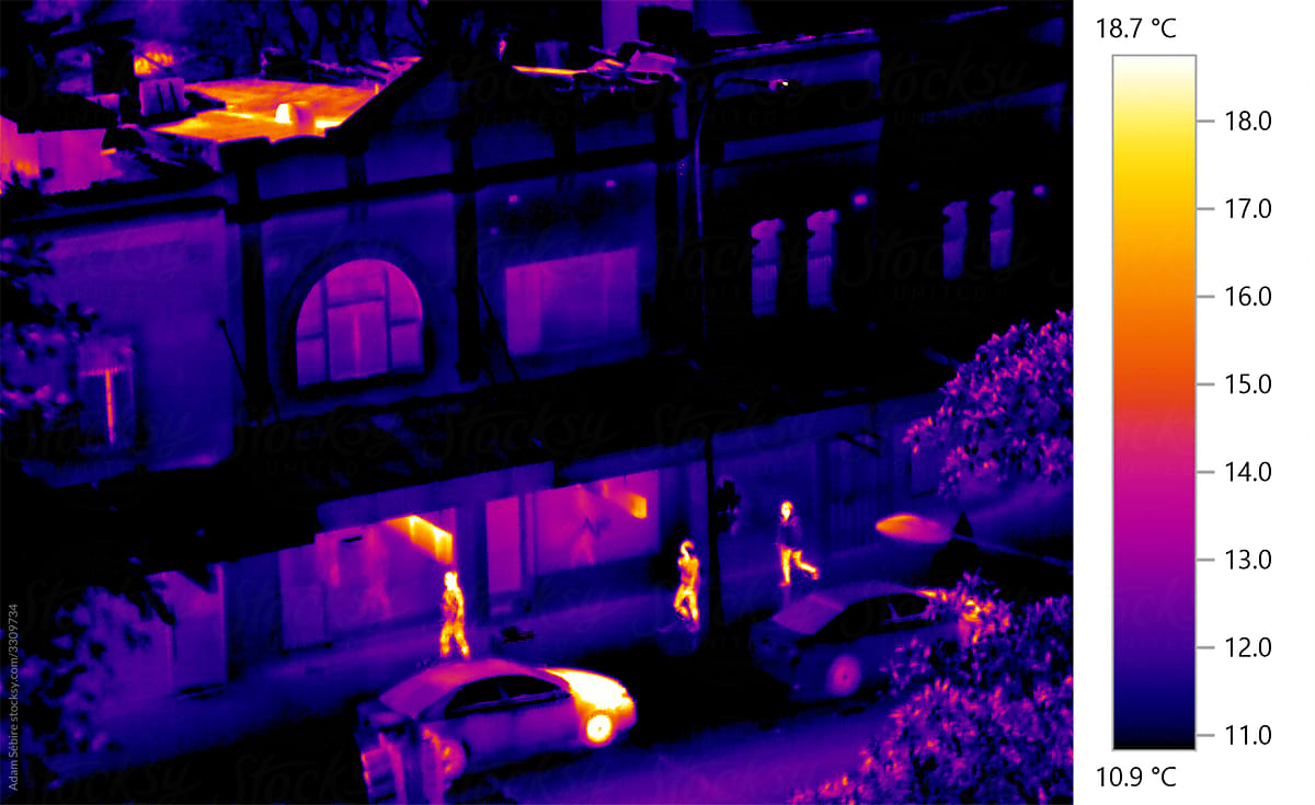 Infrared heat thermal image of urban streets, roads revealing hotspots, pedestrians, cars