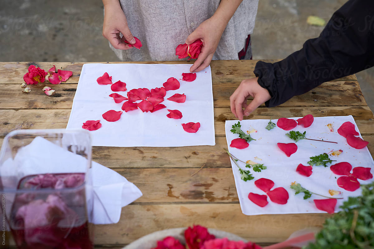 Dyed cloth pattern being made with natural plants and flowers,closeup