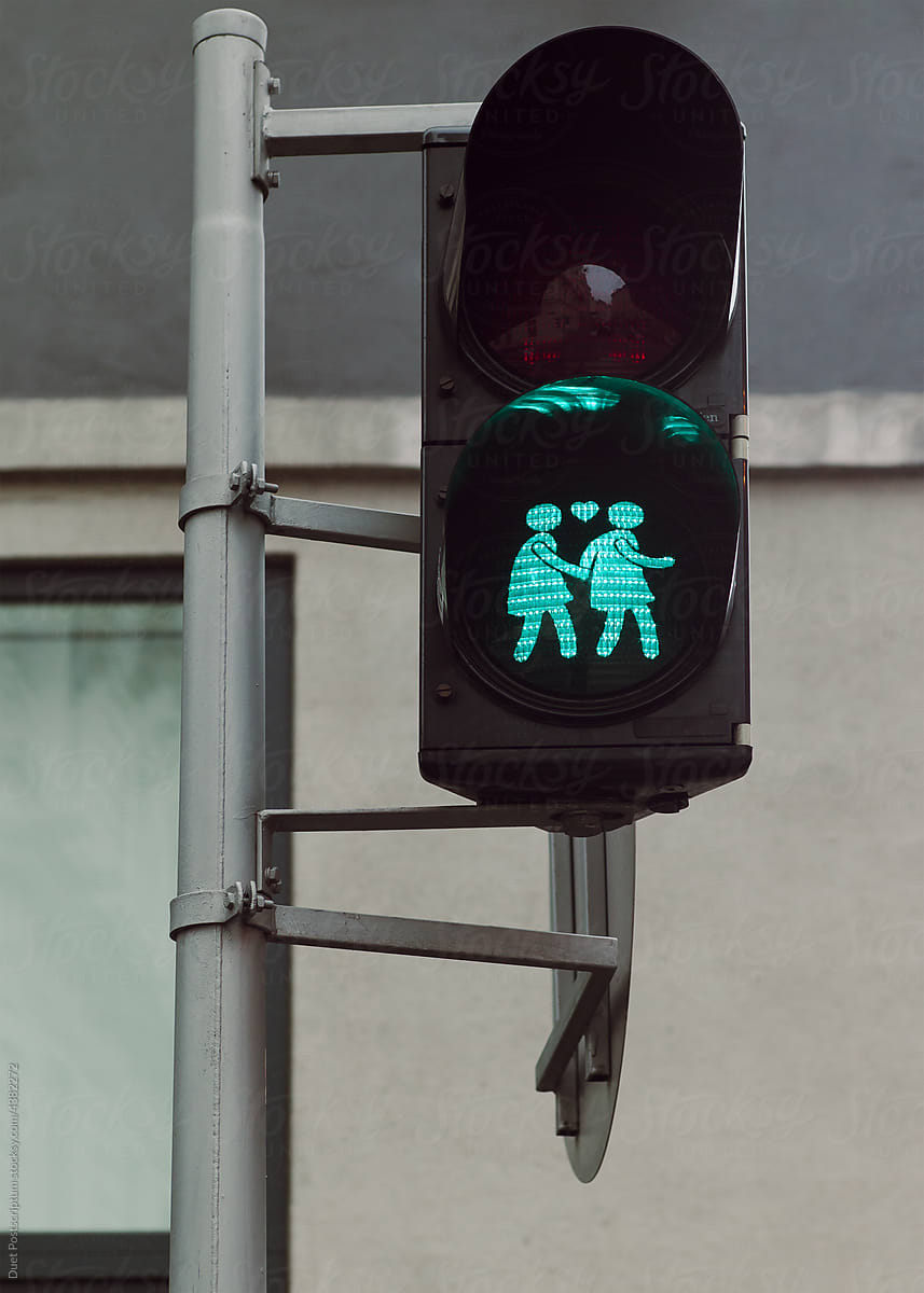 Traffic light of Vienna, with two girls holding hands